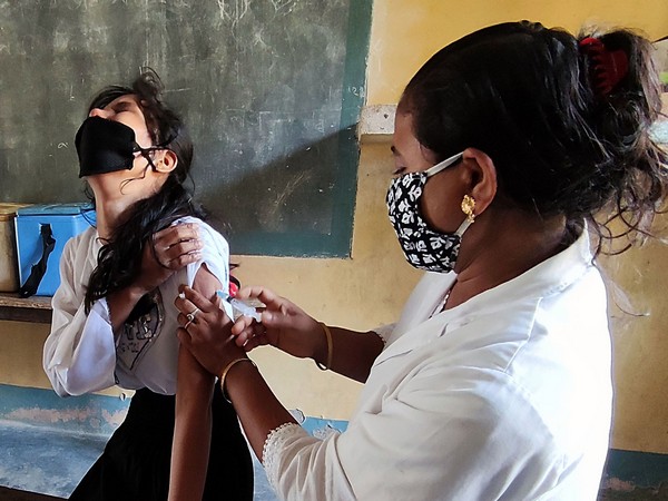 A medic inoculates the dose of the COVID19 vaccine at a vaccination centre