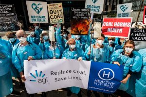 Healthcare workers stage climate ‘die-in’ at AGL  Melbourne office