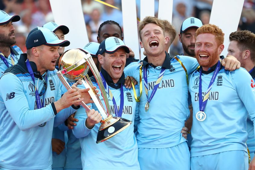 England Captain Eoin Morgan lifts the World Cup with the England team after victory for England during the Final of the ICC Cricket World Cup 2019 between New Zealand and England at Lord's Cricket Ground on July 14, 2019 in London, England.